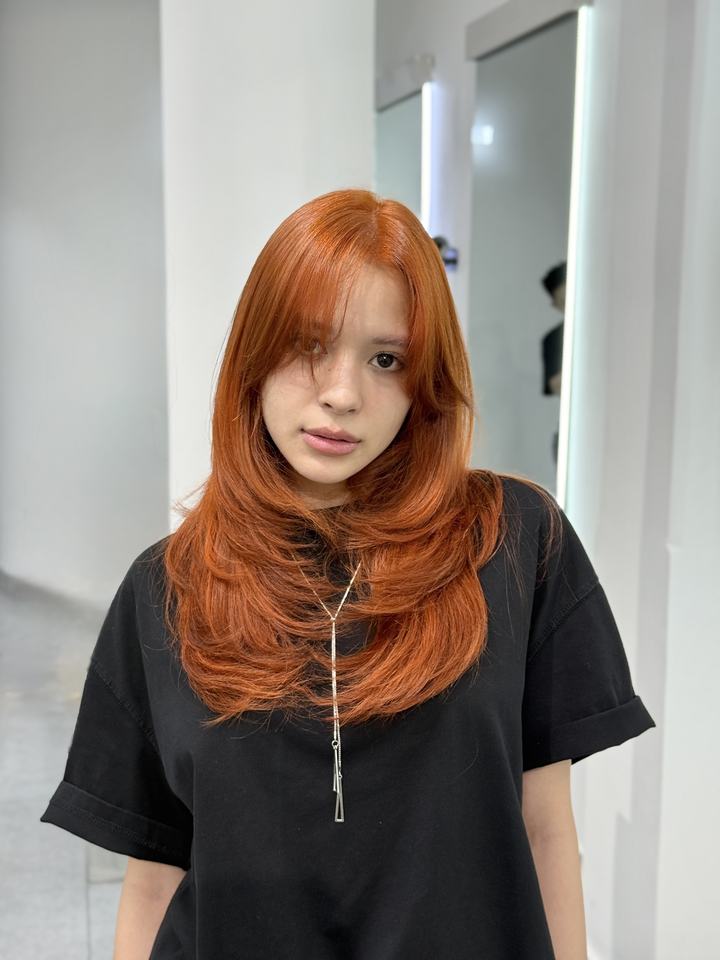 Mẫu nhuộm tóc màu cam đồng tại The New's Hair